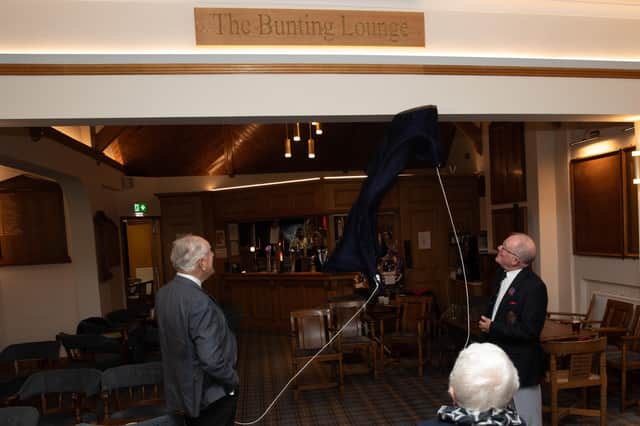 Derek Bunting and Mick Chalk officially unveil the new Bunting Lounge plaque at Seaton Carew Golf Club.