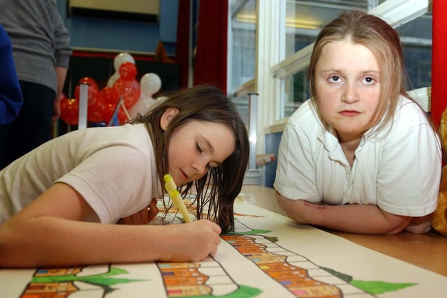 These pupils were creating artwork for a fair at the school 19 years ago.