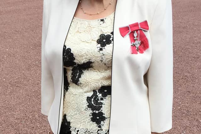 Dorothy after receiving her MBE at Buckingham Palace in May 2016.