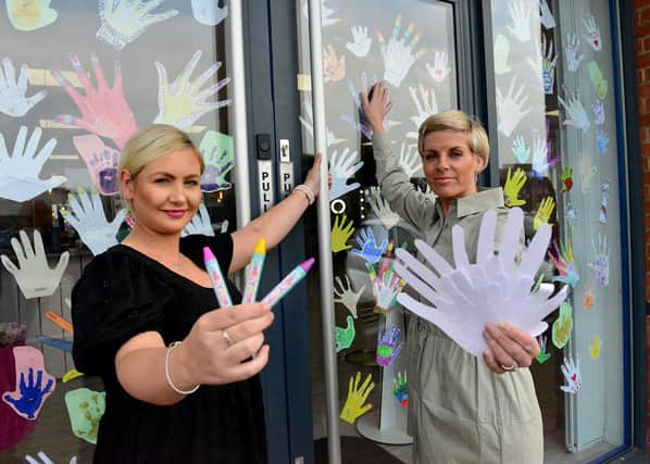 General manager Michaela Porritt (left) and salon owner Kirsty Wearmouth  outside of At Ladies Room.