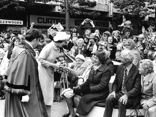 Queen Elizabeth II meets wellwishers in Middleton Grange Shopping Centre, Hartlepool, in July 1977 as part of her Silver Jubilee celebrations.