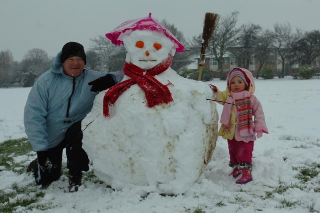Billy Reid with his two-year-old granddaughter Macey Fleetham-Reid and their snowman in Rossmere Park in 2009. Picture by FRANK REID.