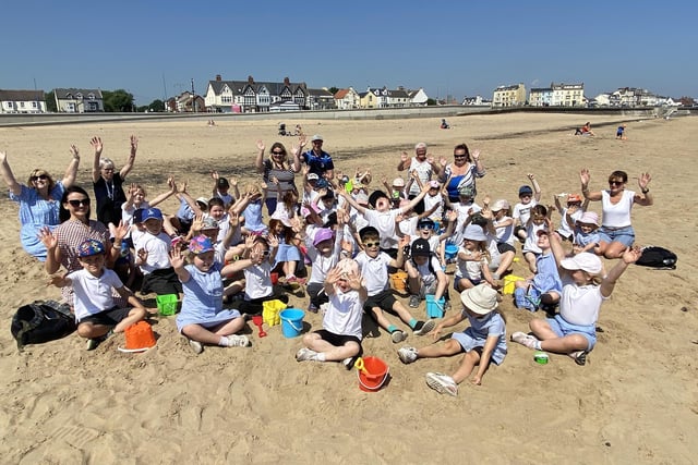 Eldon Grove Academy pupils and staff wave for the camera during their field trip to Seaton Carew. Picture by FRANK REID