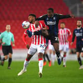 Tyrese Campbell of Stoke City battles for possession with Marc Bola of Middlesborough during the Sky Bet Championship match between Stoke City and Middlesbrough at Bet365 Stadium on December 05, 2020 in Stoke on Trent, England. The match will be played without fans, behind closed doors as a Covid-19 precaution. (Photo by Gareth Copley/Getty Images)