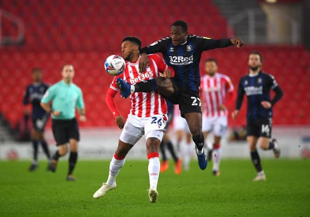 Tyrese Campbell of Stoke City battles for possession with Marc Bola of Middlesborough during the Sky Bet Championship match between Stoke City and Middlesbrough at Bet365 Stadium on December 05, 2020 in Stoke on Trent, England. The match will be played without fans, behind closed doors as a Covid-19 precaution. (Photo by Gareth Copley/Getty Images)