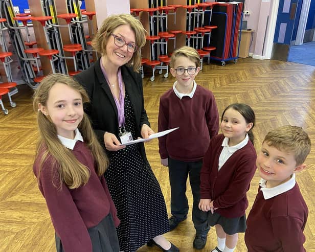 St Cuthbert's Catholic Primary School has been rated "good" by Ofsted inspectors following their latest inspection. Pictured is the headteacher, Mrs Joanne Wilson, with pupils Alice, Perrin, Lily and Joseph.
