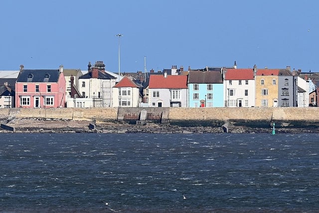 Picture postcard. The Headland is known for its colourful houses, Andy Capp statue and energetic seabirds.