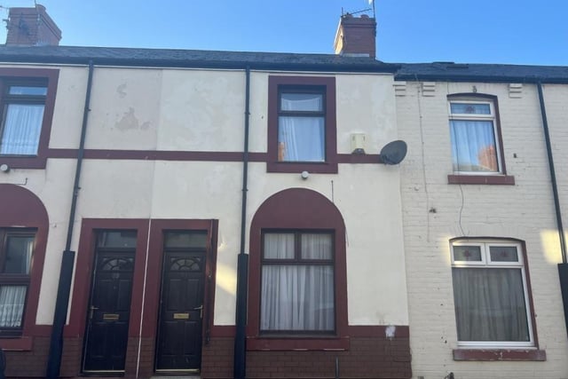 The two bed mid terrace property in Dent Street (pictured, right door) is to be sold later this month via online auction.