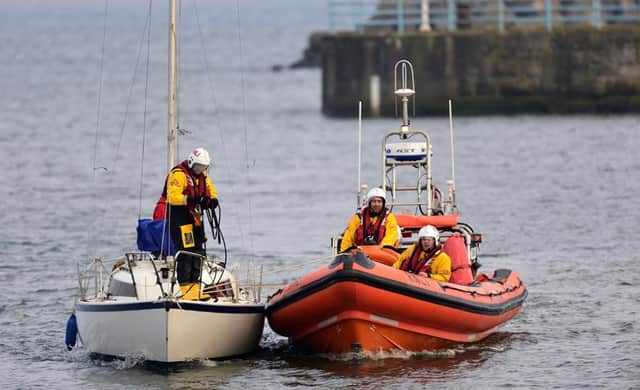 Hartlepool inshore lifeboat 'Solihull' and volunteer crewmembers towing the yacht to Hartlepool Marina. Picture by Tom Collins/RNLI