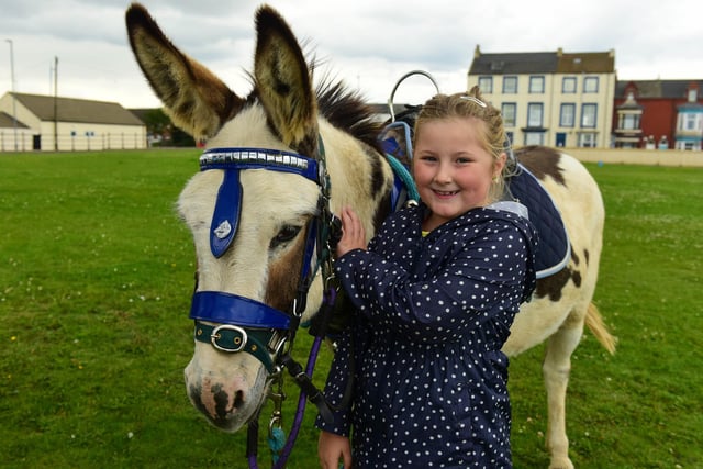 The Miles for Men fun day for charity at the Clock Tower, Seaton Carew. Scarlett Freeman (7) was pictured with one of the donkeys at the donkey ride in 2017.