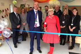 Shonette Bason-Wood prepares to cut the ribbon on Jesmond Gardens Primary School's new nursery building with headteacher Philip Pritchard (left) and representatives from Cole Construction and Bryal Consultancy.