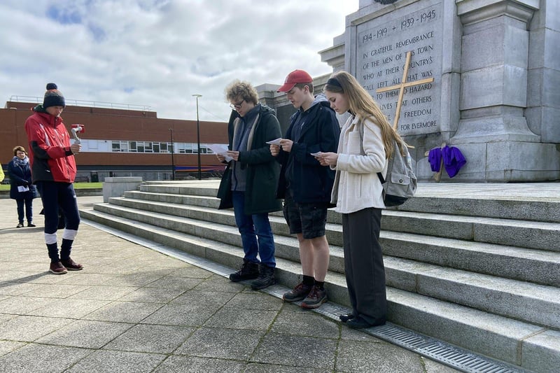 Three worshippers lead the prayer service at the War Memorial at the end of the Good Friday Walk of Witness. Picture by FRANK REID