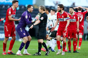 Marcus Bettinelli of Middlesbrough argues with referee Gavin Ward as he awards a late penalty to Swansea City.