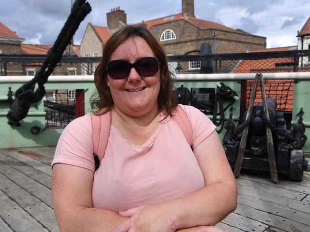 Amy McCloskey climbs aboard the HMS Trincomalee.
