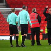 Neil Warnock, manager of Middlesborough is held back by a steward during the Sky Bet Championship match between Stoke City and Middlesbrough at Bet365 Stadium on December 05, 2020 in Stoke on Trent, England. The match will be played without fans, behind closed doors as a Covid-19 precaution. (Photo by Gareth Copley/Getty Images)