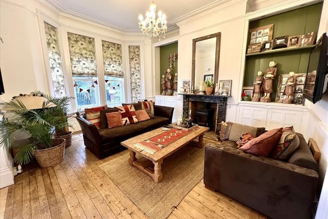 The sitting room is complete with period feature fireplace.