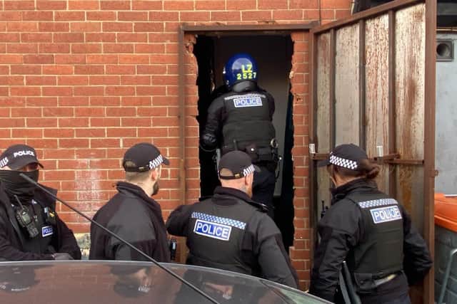Police carry out a search of one of the units. Picture by FRANK REID