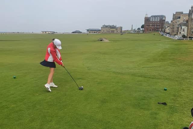Amy gets in the swing at St Andrews.