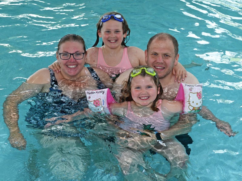 Darren Anderson and Emily Anderson, pictured with daughters Olivia, six and Sophie, nine.