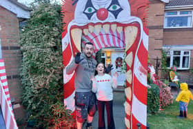 Pete Noble and ten-year-old Ariana with one of this year's decorations.