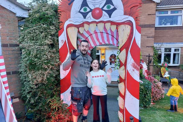 Pete Noble and ten-year-old Ariana with one of this year's decorations.