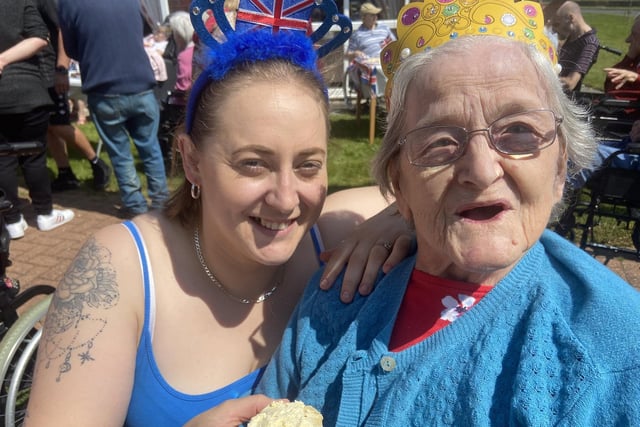 Amy McIntyre, left, enjoying a cake with Jean Walker at Warrior Park Care Home.