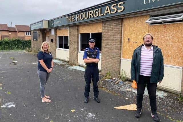 Labour councillors Pamela Hargreaves and Ben Clayton with neighbourhood police on The Hourglass pub site after the fire last September.