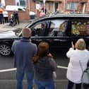 Well wishers line the streets of Ashington in Northumberland to pay their respects as the funeral cortege for Jack Charlton passes through his childhood home town.