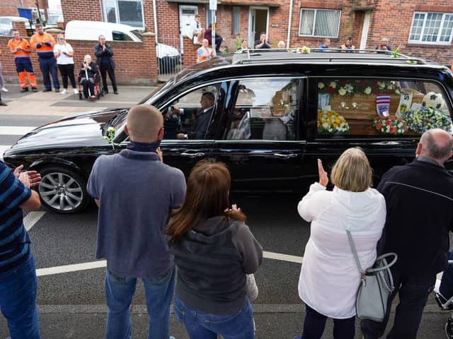 Well wishers line the streets of Ashington in Northumberland to pay their respects as the funeral cortege for Jack Charlton passes through his childhood home town.