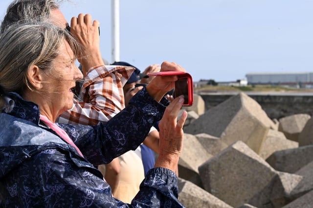 Photographers and the public grab one of the best viewing points to see the tall ships on Sunday. Picture by FRANK REID