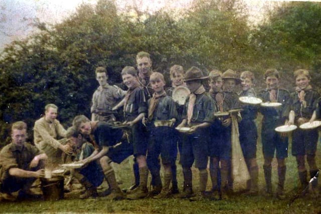 This picture from the 1930 shows West Hartlepool boy scouts lining up for their rations during a summer camp in the country.