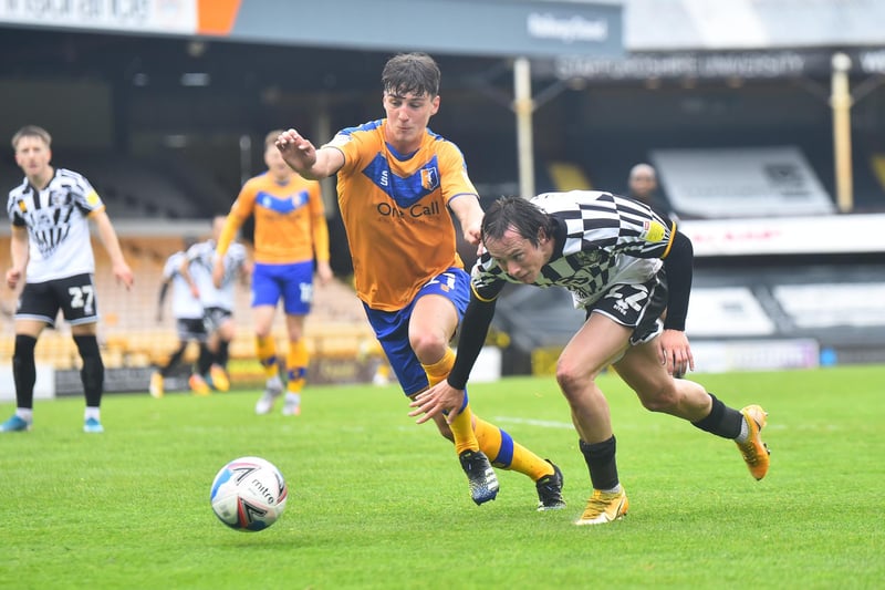 Harry McKirdy of Port Vale and James Clarke of Mansfield Town compete for the ball during the last game of the season at Vale Park.