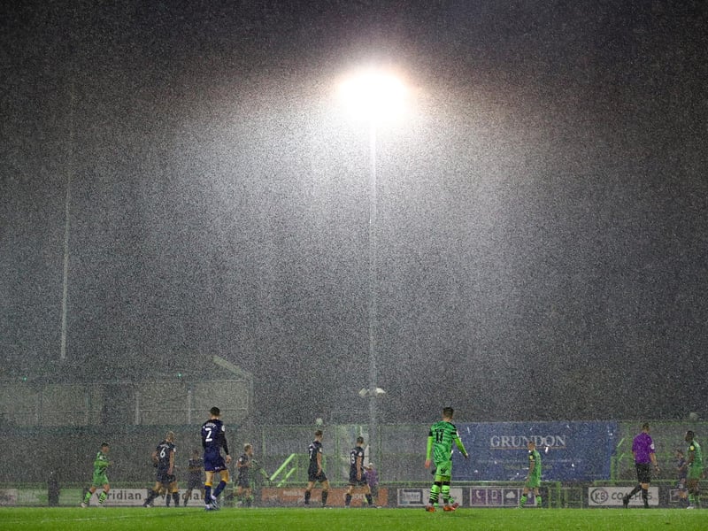 Rain pours down in the gaame at Forest Green.