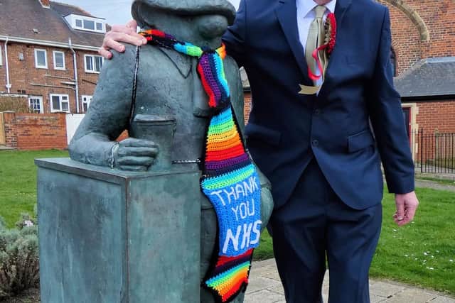 North East Party candidate Hilton Dawson next to Hartlepool's Andy Capp statue.