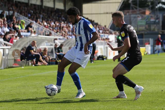 Tyler Burey of Hartlepool United in action with Rod McDonald of Carlisle United during the Sky Bet League 2 match between Hartlepool United and Carlisle United at Victoria Park, Hartlepool on Saturday 28th August 2021. (Credit: Mark Fletcher | MI News)