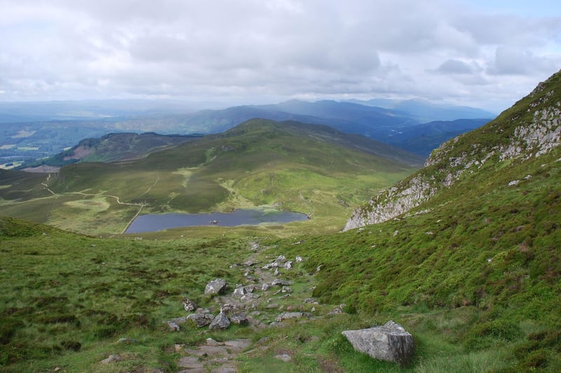 A popular peak for those visiting nearby Pitlochry, an ascent of Ben Vrackie follows good paths through woodland, moorland and pretty Loch a' Choire.