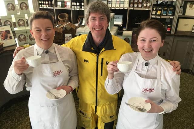 Hartlepool RNLI crewmember Colm Simpson pictured with Bettys Café Tea Rooms staff. Picture by Tom Collins.