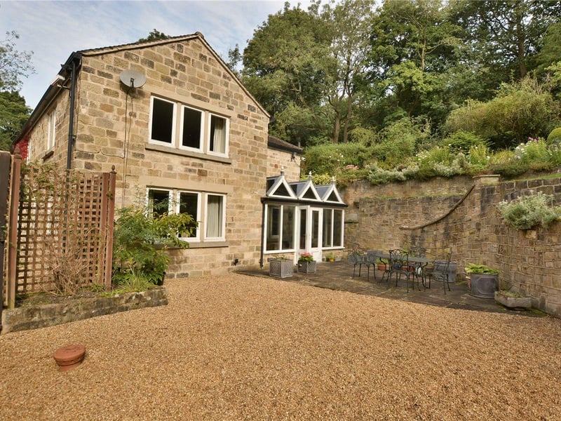 To the rear of the property is a large terrace area which is ideal for outdoor entertaining, while a gravel driveway with electric gates, a detached double garage and pathway are located to the front.