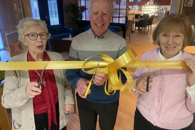 Hartfields residents (left to right) Mary Fletcher, George Wood and Marilyn Caygyll cut the ribbon to officially open the new coffee shop. Picture by FRANK REID