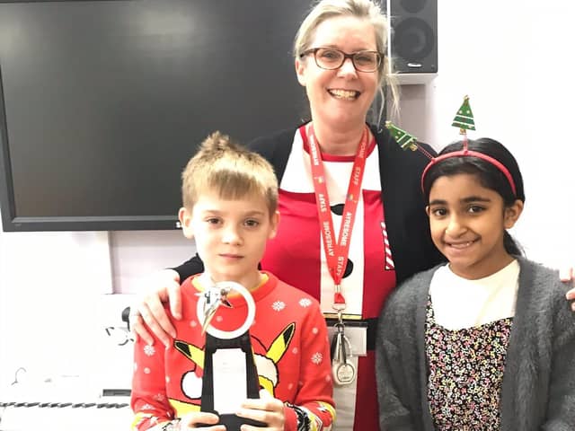 Headteacher Charlotte Haylock, Max Wilkins and Nayab Kousar with the Alby Pattison Award.