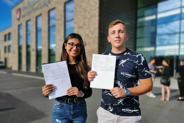 Head girl Anjalee Dhaliwal and head boy Max Strelitz with their results.