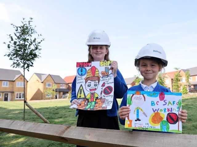 Hattie and Libby from Wingate Primary School with the posters they designed to win the Bellway art competition.