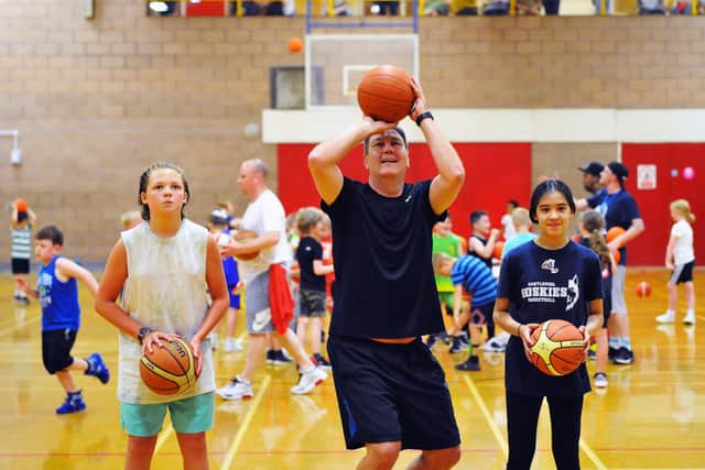 Steve Turner shooting hoops with Hartlepool Huskies players Sam Wheeler (left) and Aliyah Haque during a training session. Picture by FRANk REID