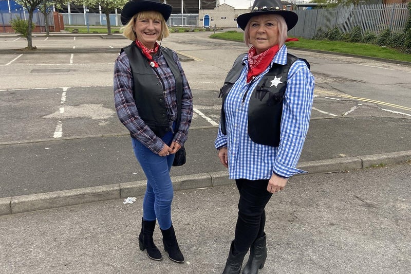 Cowgirls Pauline and Winnie wait for the bus to Hartlepool United's last game of the season at Stockport County. Picture by FRANK REID
