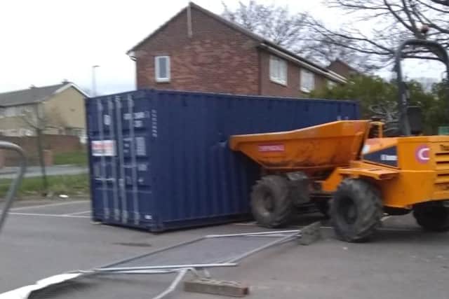 The dumper truck was left in the side of a container following the raid. Image by East Durham Trust.