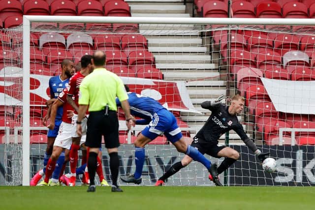 Cardiff City captain Sean Morrison heads his side in front against Middlesbrough.