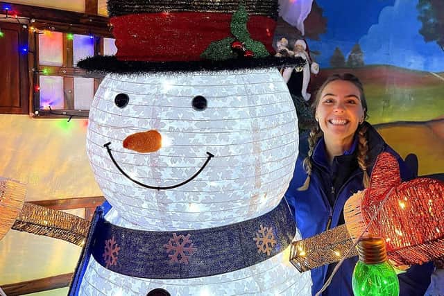 Phoebe Wayman, the events manager at Tweddle Farm, with the friendly snowman at the start of Santa's Grotto.