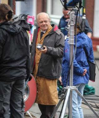 Sir David Jason playing Granville speaks to the film crew on set.