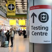 LONDON, ENGLAND - NOVEMBER 28: A covid testing centre sign at Heathrow Terminal 5 on November 28, 2021 in London, England. Following the discovery of a new Covid-19 variant, whose mutations  suggest greater transmissibility than previous virus strains, the United Kingdom imposed new restrictions on arriving travelers. From 04:00 today, people arriving from South Africa, Botswana, Lesostho, Eswatini, Zimbabwe and Namibi, Malawi, Mozambique, Zambia, and Angola will face mandatory hotel quarantine. From Tuesday, all international travelers must isolate until they return a negative PCR test, which must be taken by Day 2. (Photo by Hollie Adams/Getty Images)