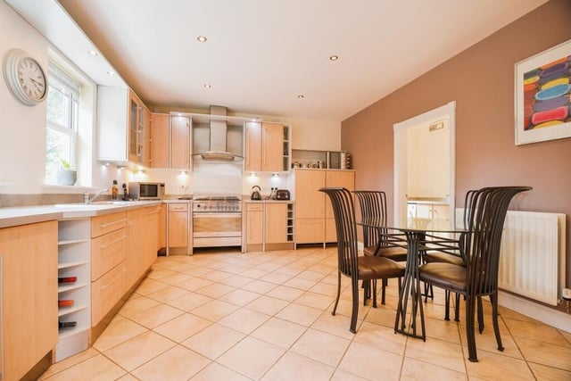 The kitchen is fitted with an extensive range of wall and base units.